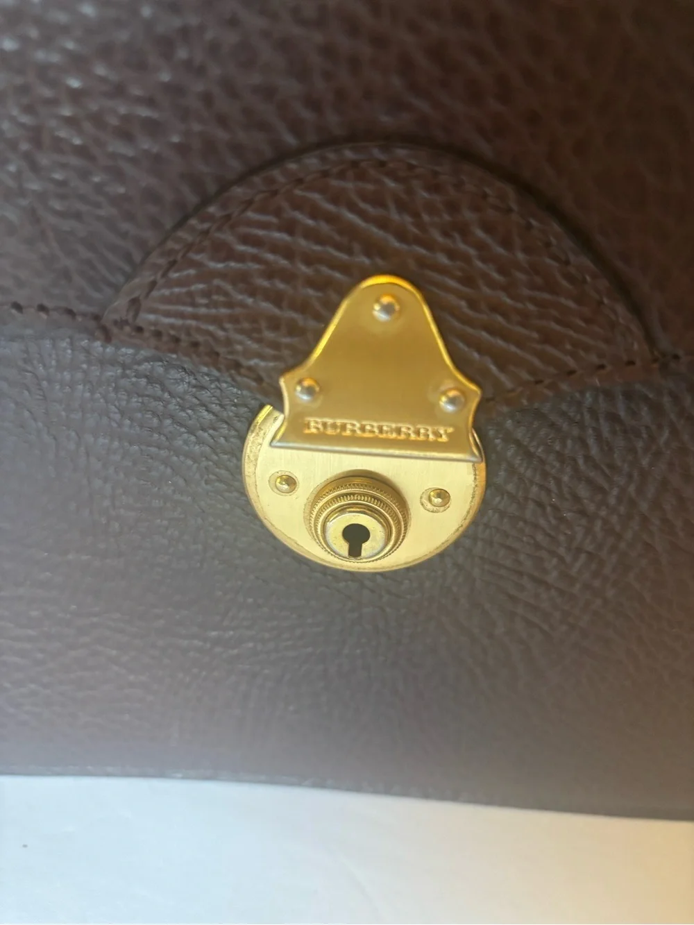 Burberry Brown Leather Clutch with Gold-Tone Lock and Scarf Accent